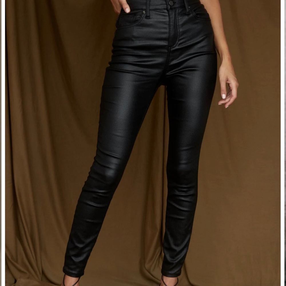 Amazing stretch faux leather-like jeans. Size 27 but a size 28 can fit.